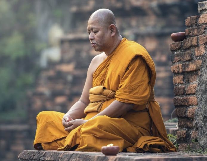 What Is Meditation - Buddhist monk practicing Meditation